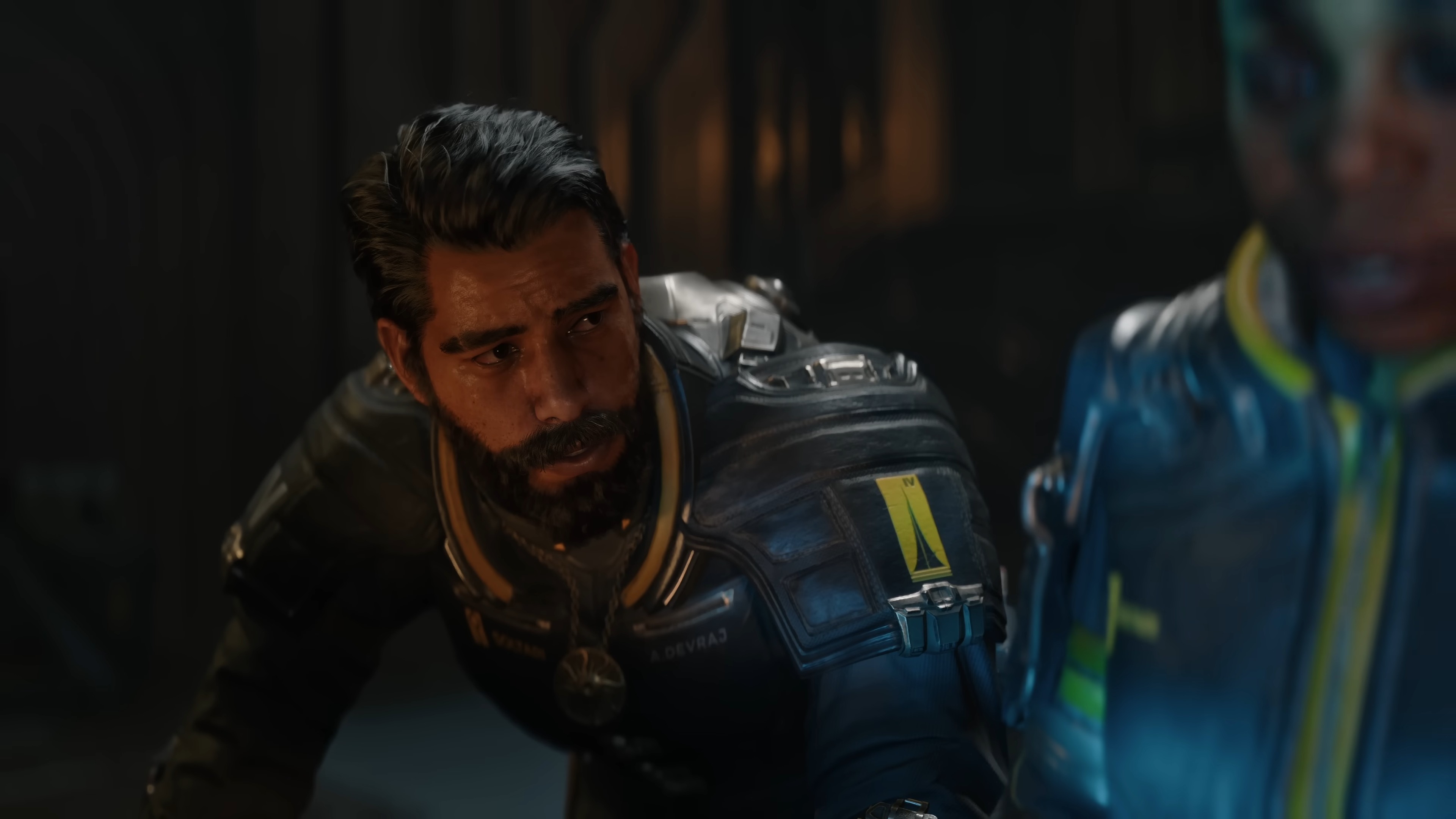 Saros launch trailer screenshot shows a concerned Arjun Devraj.