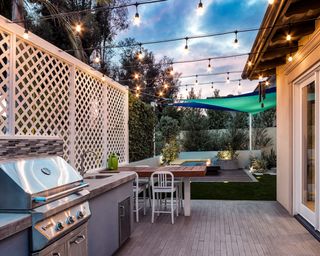A side yard with outdoor kitchen