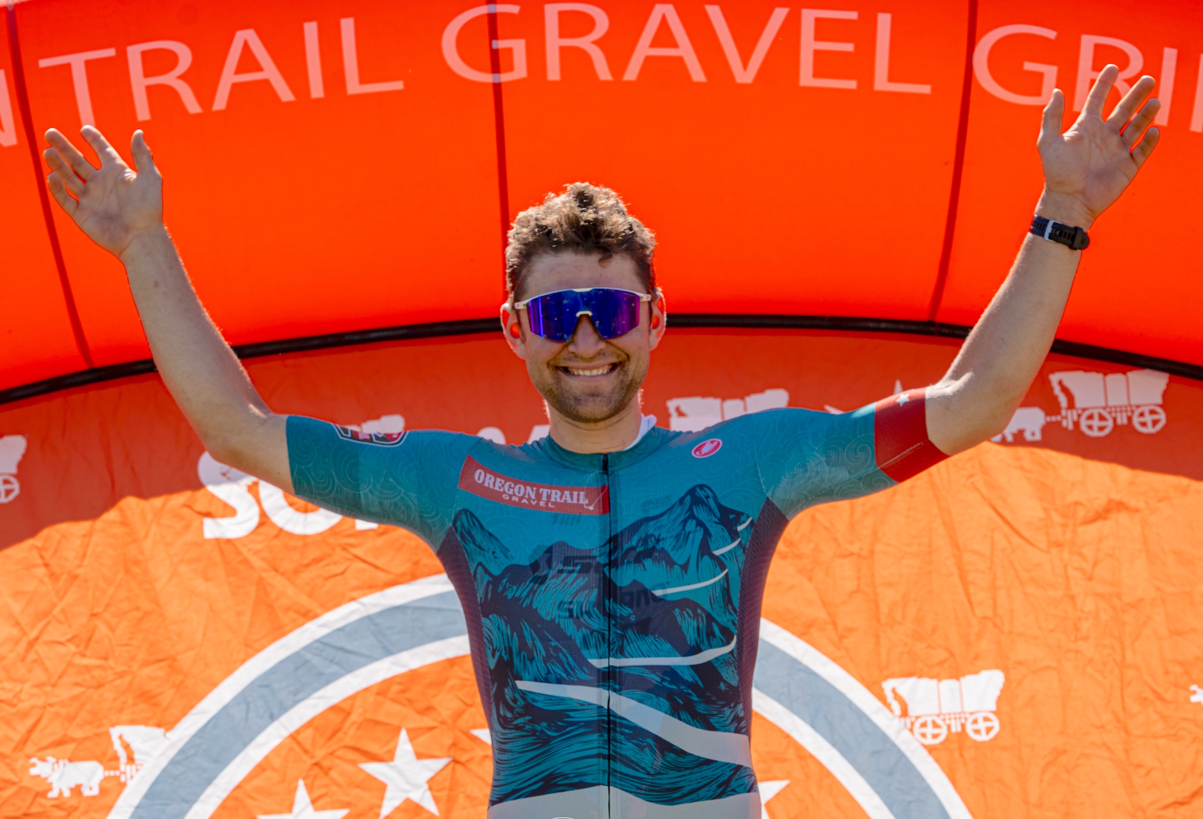 Cameron Jones celebrates winning the 2025 Oregon Trail Gravel Grinder