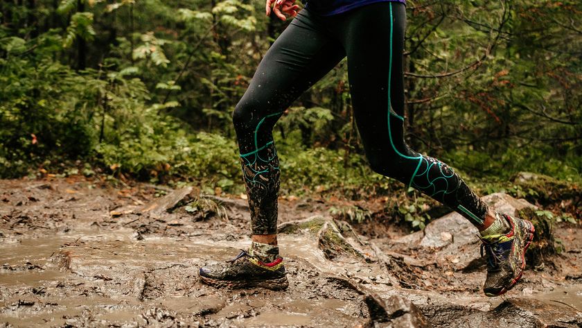 A person running through a muddy trail 