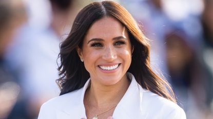 Meghan, Duchess of Sussex attends a reception for friends and family of competitors of the Invictus Games at Nations Home at Zuiderpark on April 15, 2022