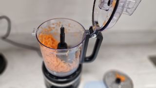 Shredded carrot inside the KitchenAid 9-Cup Food Processor