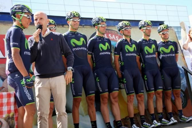Movistar Team riders on stage. Nairo Quintana chats with the speaker, Juan Mari Guajardo