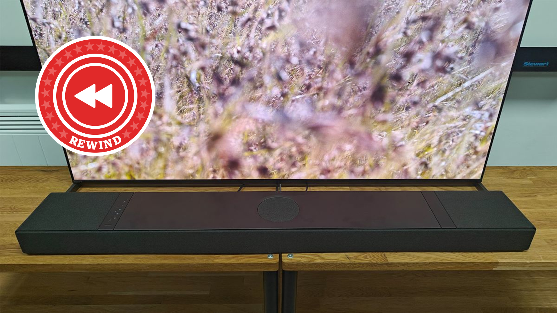 KEF XIO on stand with Rewind logo
