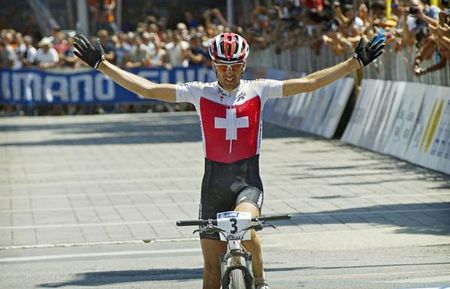 Christoph Sauser (Switzerland) earns his second marathon world title.