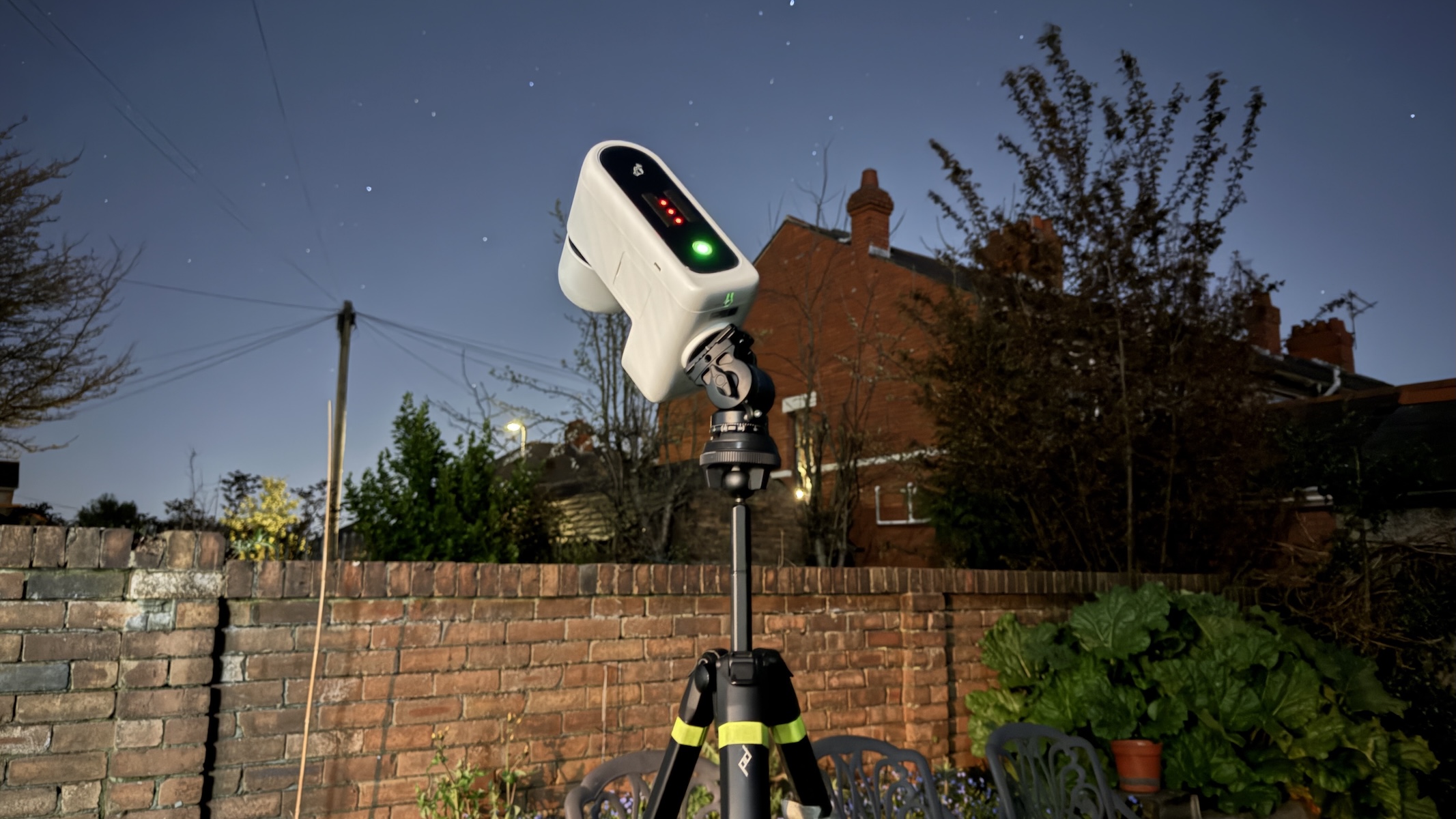 ZWO SeeStar S30 Pro on a tripod under the night sky