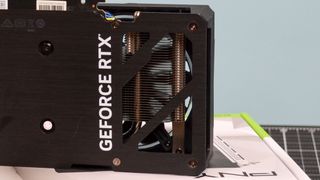 A PNY GeForce RTX 4060 Verto on a table with its retail box