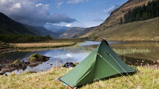 A green tent in the Scottish mountains