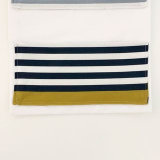 black strips pocket sewed on white fabric