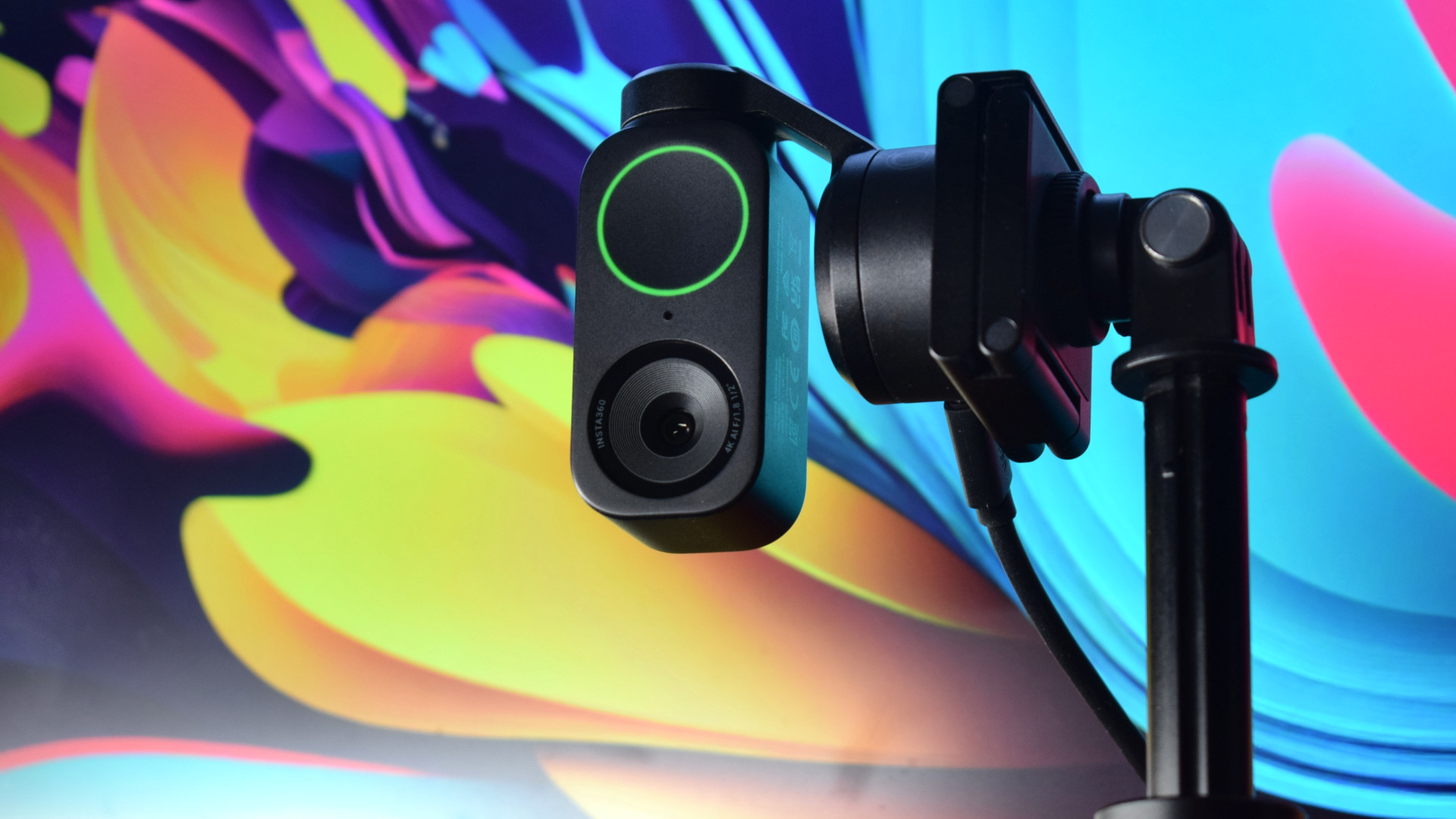 Photo of the Insta360 Link 2 4k webcam showing the camera in portrait orientation, ideal for social media or smartphone-friendly capture, by use of the Magnetic Mount and a tripod.