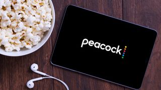 Peacock app on a tablet with popcorn