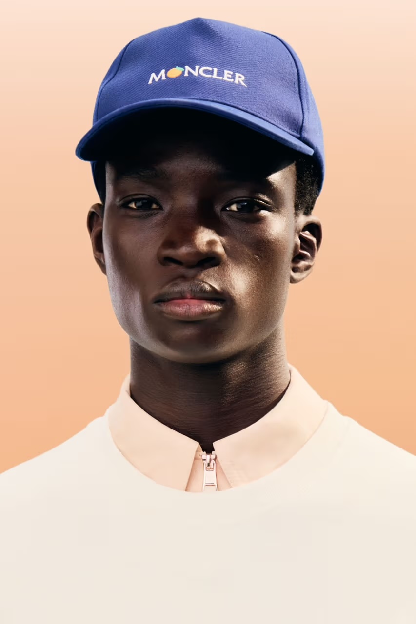 Blue cap with the Moncler logo on to top