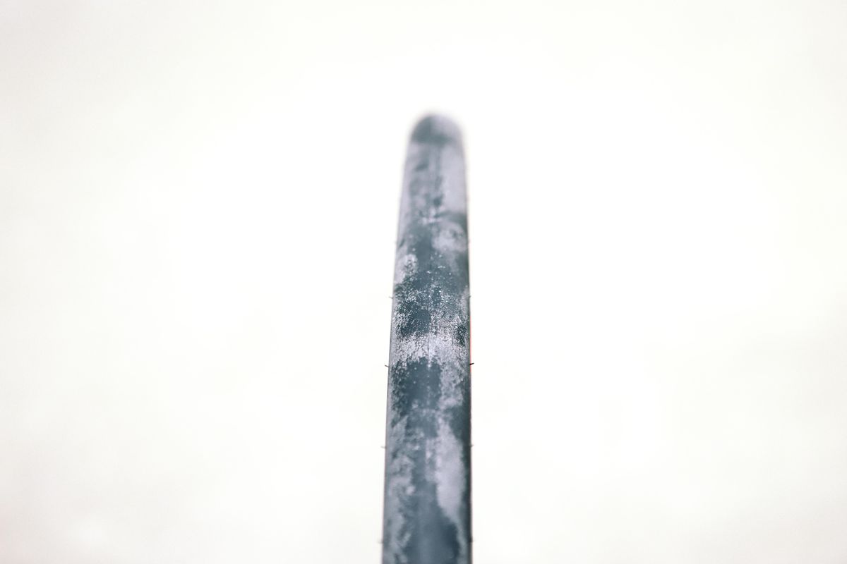 a close up of a black road bike tyre