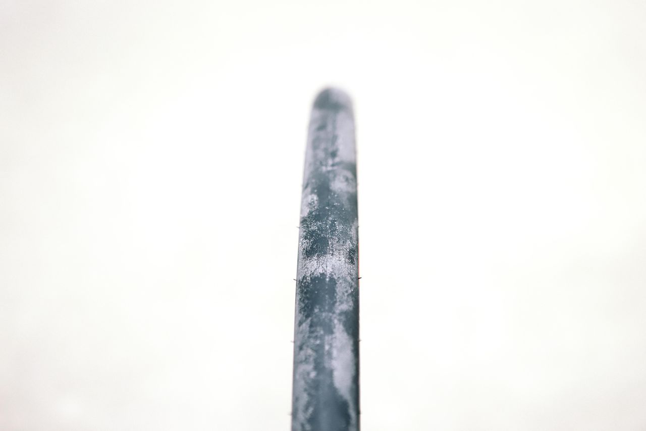 a close up of a black road bike tyre