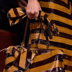 Close-up images of a look from the Fendi FW25 show that feature eel print.