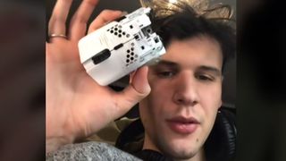 boneyttv holds the mouse he cut in half.