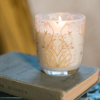 printed scented candle on grey book