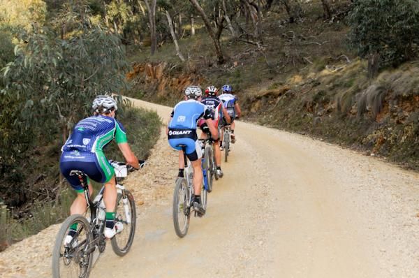 Riders start to string out as the course heads uphill.