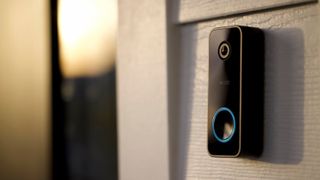 Wyze video doorbell mounted on a wall