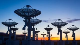 A sea of observatory antenna at sunset