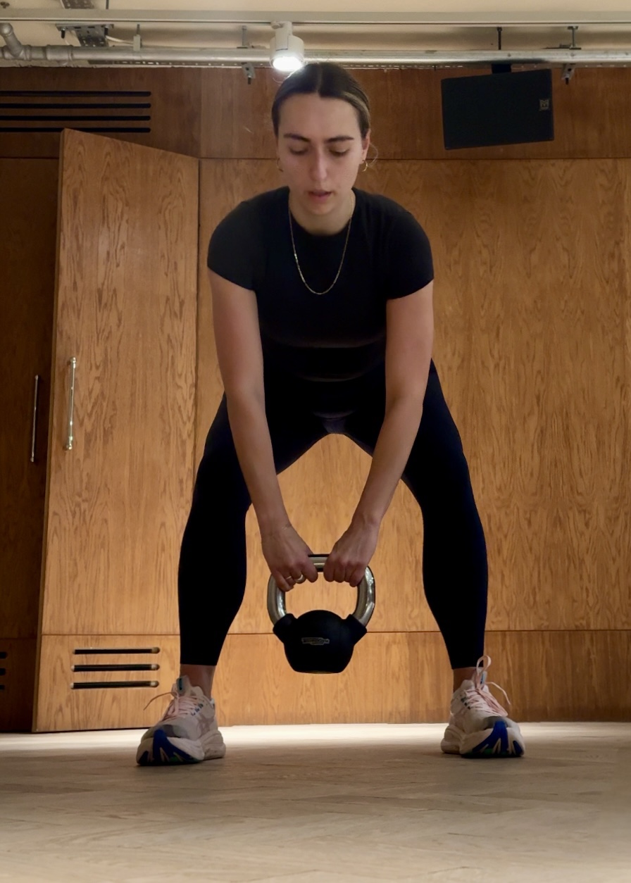 Health writer Georgia Brown performing kettlebell swings