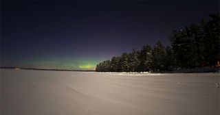 The northern lights were spotted over Sebago Lake in Maine early Feb. 19, 2014.