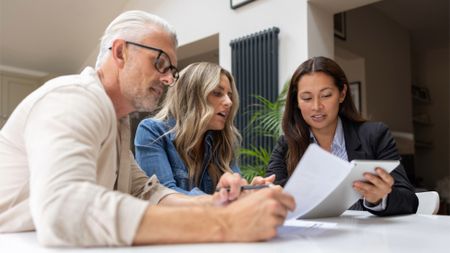 Financial adviser talking to a couple about their options
