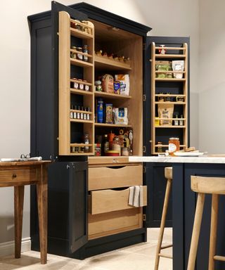 navy freestanding double door kitchen larder unit with wooden interior and drawers