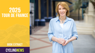 Retired cyclist Philippa York stands in front of a soft background wearing a blue shirt