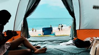 People relaxing in a beach tent