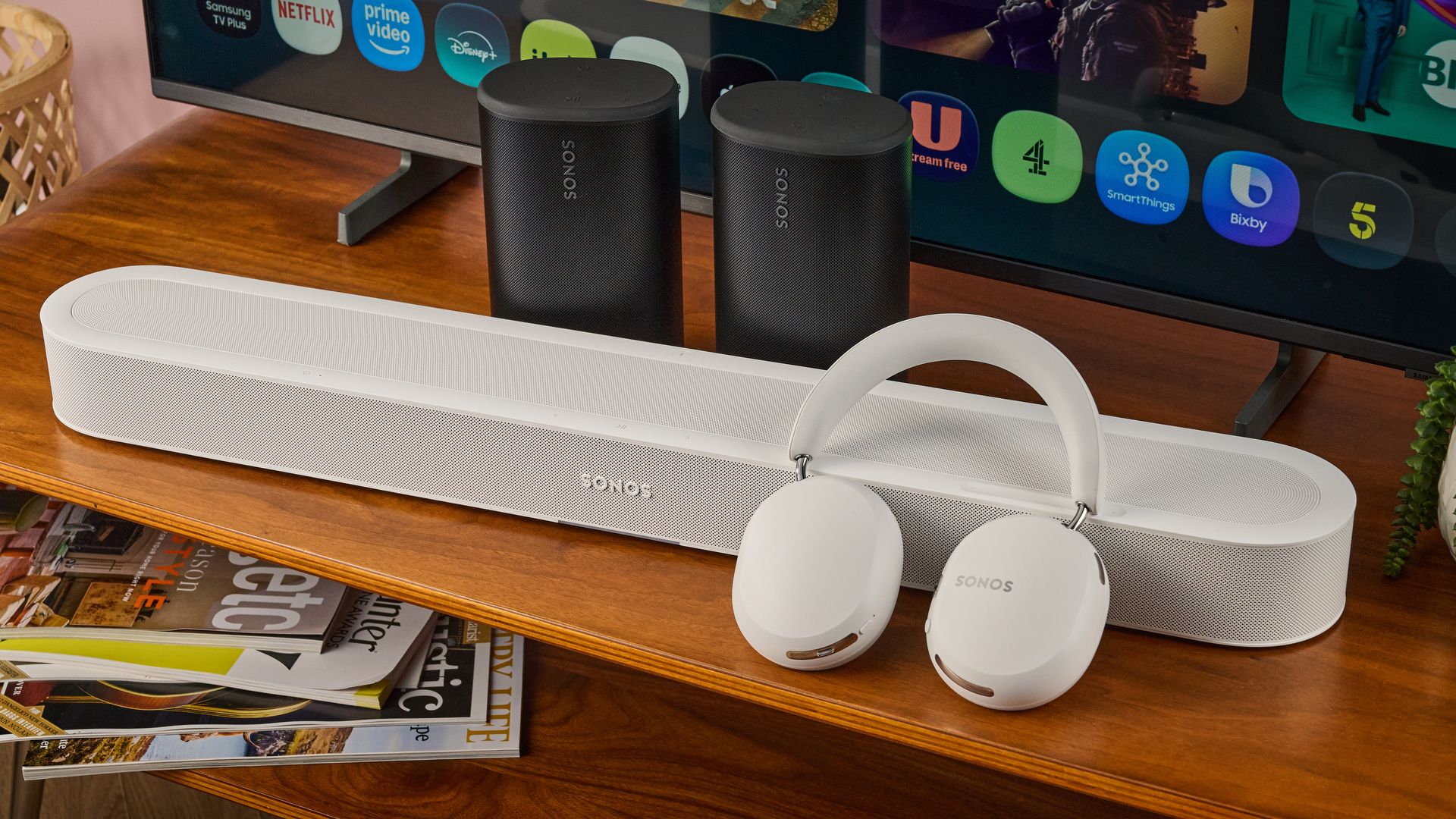 Sonos Ace Ultra balanced against the Sonos Beam Ultra with Sonos Play speakers and TV