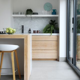 White kitchen with wooden cabinet and drawers