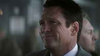 Michael Madsen smirks in conversation in Die Another Day.