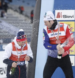 olympic athletes celebrating with champagne