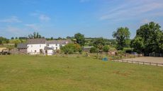 Greenwood-Farm-back-of-house-and-part-of-sand-school.jpg