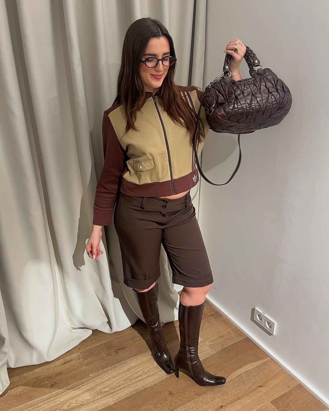 woman wearing knee high fitted boots