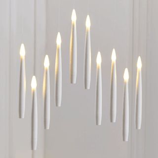 10 floating candles in the air
