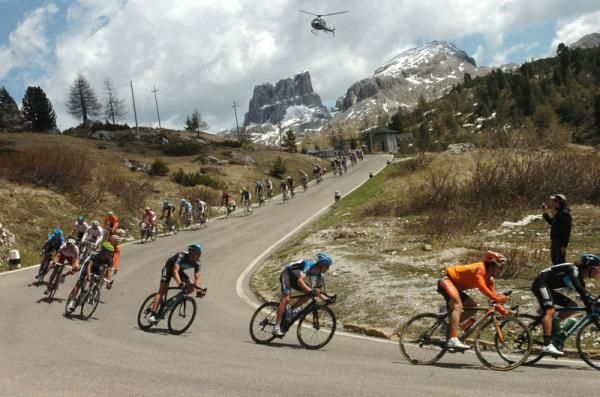 The peloton descend through some of Italy's most scenic landscapes