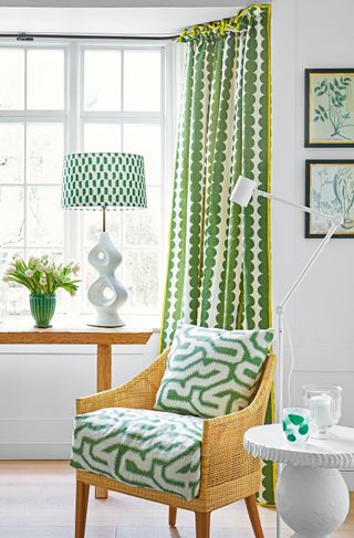 White living room with curtains in Schumacher's Full Circle, Jungle fabric