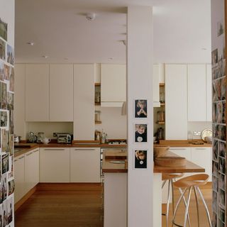 kitchen room with wooden flooring and white pillar