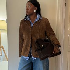 woman in suede jacket and bag