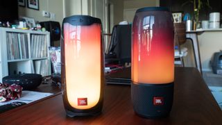 The JBL Pulse 4 (on left) next to the JBL Pulse 3 (on right).