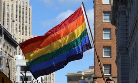 A man waves a gay pride flag in San Francisco: On Thursday, a New York court became the second federal court to rule that the Defense of Marriage Act, which designates marriage as between one