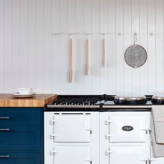 how to panel a wall, blue and white coastal style kitchen with tongue and groove white panelling, hanging rail, Aga