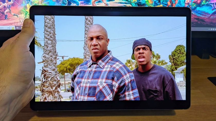 Samsung Galaxy Tab S10 Plus held up with movie Friday playing on display