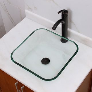 A square glass sink and matt black tap