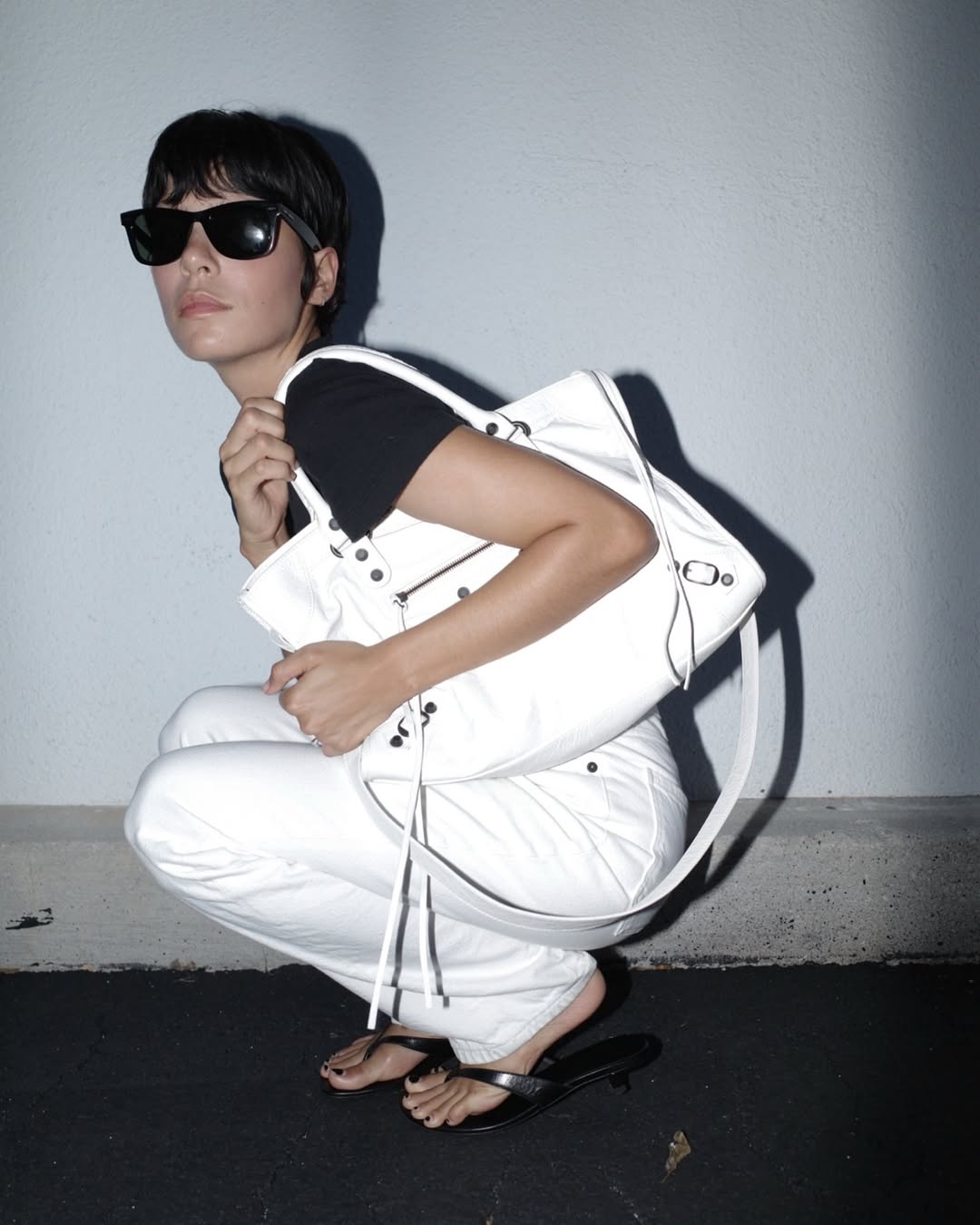 woman wearing balenciaga city bag