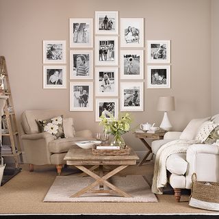 living room with apricot colored wall and lozenge photo frame