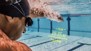 Form Smart Swim Googles worn by man in pool with workout info displayed