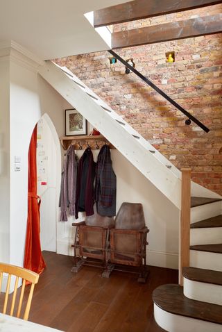 staircare in apartment with brickwork and wooden floor